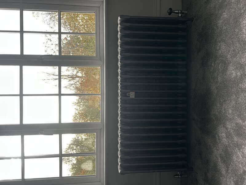 Radiator installed by window